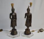 CHINE - TIBET
Deux divinités en bronze, montés en lampe
H. totale:...