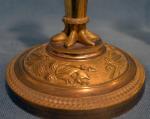 Paire de FLAMBEAUX en bronze doré, la base circulaire ciselé...