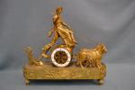 PENDULE en bronze ciselé et doré représentant le char de...