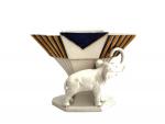 ROYAL DUX
Coupe en porcelaine figurant un éléphant
H.: 16.5 cm (éclat...