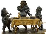 GROUPE en bronze représentant trois personnages autour d'une table
H.: 7.5...