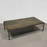 Maison BAGUES
Table basse rectangulaire en bronze en partie doré, à...