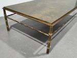 Maison BAGUES
Table basse rectangulaire en bronze en partie doré, à...