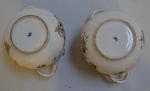 ALLEMAGNE
Paire de chache-pots en porcelaine à décor polychrome, deux anses...