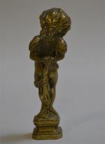 CACHET en bronze représentant un angelot, la base vierge
H.: 10...