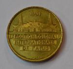 A. MOUROUX Médaille ronde en métal doré Exposition coloniale internationale...