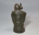 INDE
Sujet en bronze représentant un sage auprès duquel se tient...
