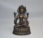 CHINE
Groupe en bronze représentant une divinité assise
H.: 19 cm