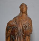 GROUPE en bois sculpté représentant un saint personnage sur une...
